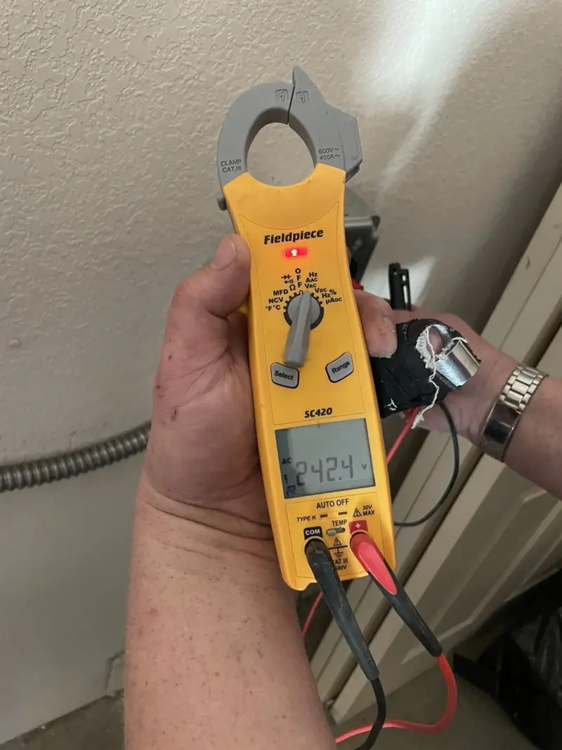 Voltage testing with clamp meter during Electrical Installation Services in Sheffield